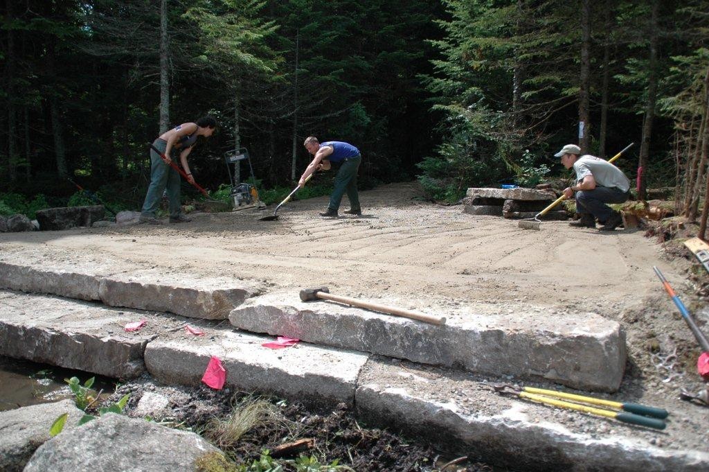 RMC trail crew members put the final touches on the  improvements to access the Pond of Safety.