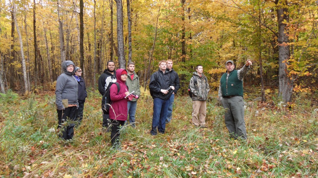  Forest Commissioner John Scarinza explains Randolph Community Forest management projects to Plymouth State University students, October, 2015.