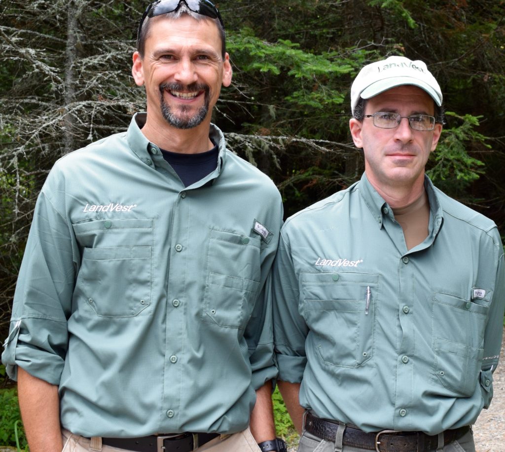 John Steward, left, of its West Stewartstown office and David Degruttola of Bethel, Me. — the new LandVest, Inc. Randolph Community Forest forestry team — were introduced to the community on Aug. 6. (Edith Tucker photo)